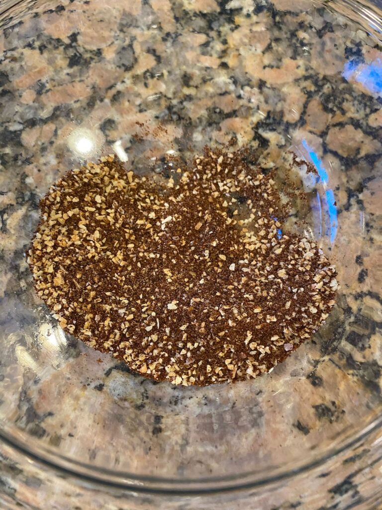 image shows dry rub ingredients mixed together in a glass bowl