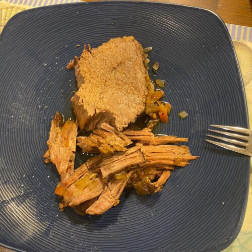 slow cooker Italian pot roast on plate with fork, ready to eat!