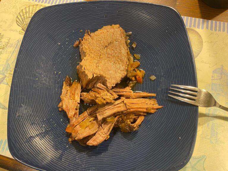 slow cooker Italian pot roast on plate with fork, ready to eat!