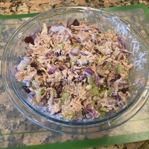 cranberry tuna salad recipe in a large bowl mixed and ready to eat