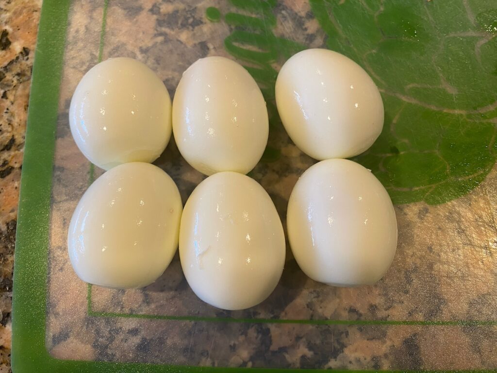 image shows 6 eggs boiled and peeled