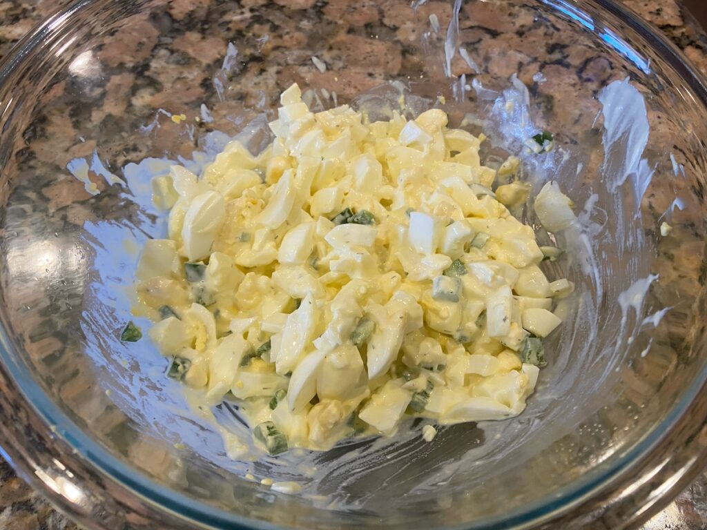image shows spicy egg salad recipe ingredients mixed together and ready to eat