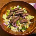 image shows finished healthy steak salad recipe in a bowl, ready to eat