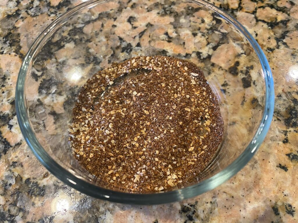 image shows slow cooker chicken tacos rub ingredients mixed together in a bowl