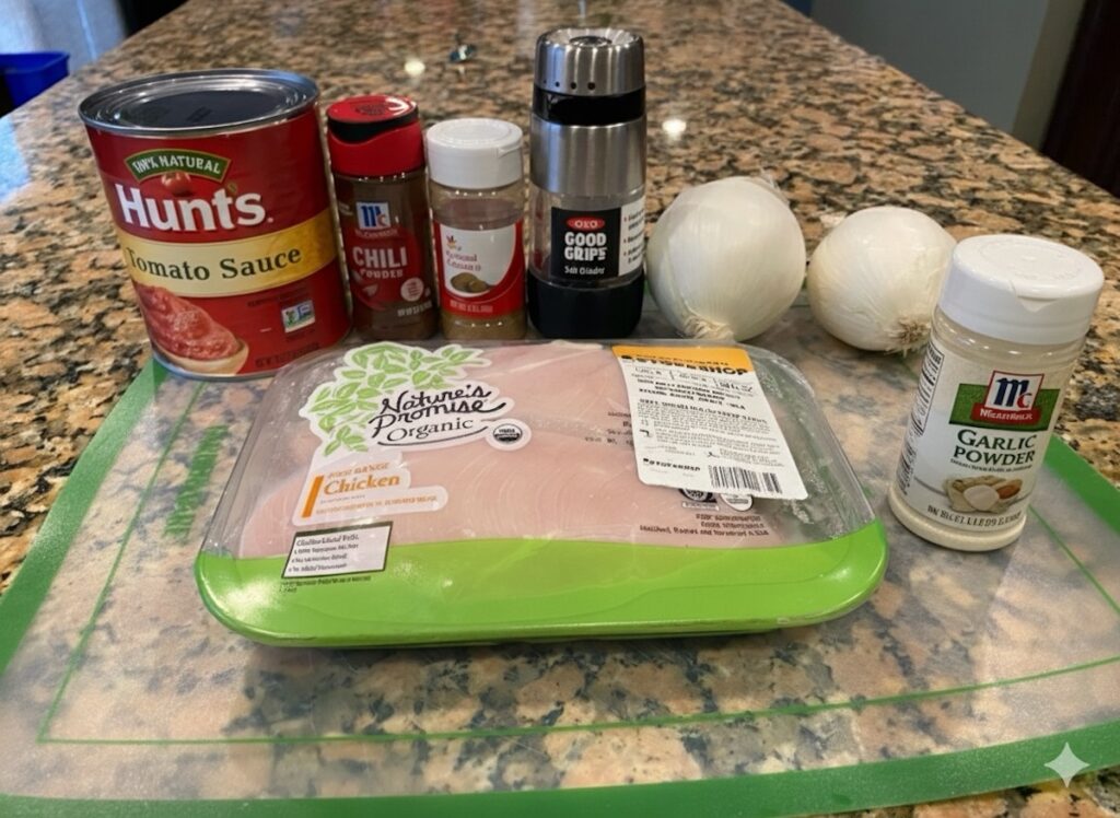 image shows ingredients for slow cooker enchilada chicken on kitchen island