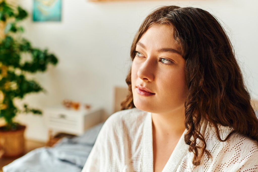 woman taking a break at home, looking off to the side and thinking