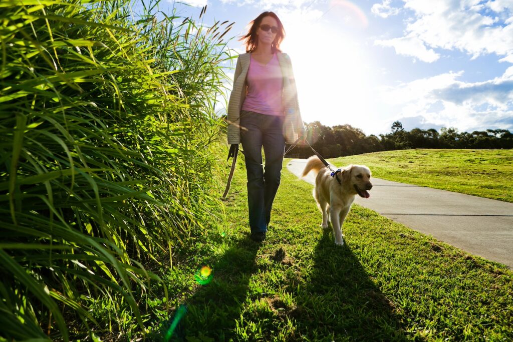 busy mom walking outdoors for low impact exercise, positive mindset around exercise
