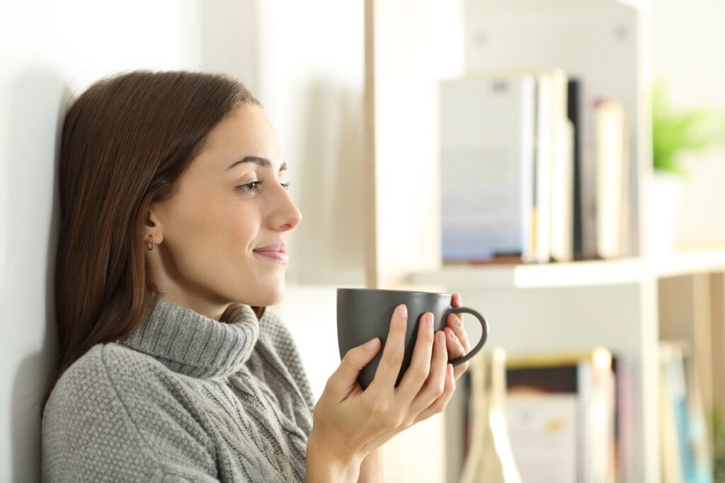 busy mom in her 40s celebrating non-scale victories in her wellness journey