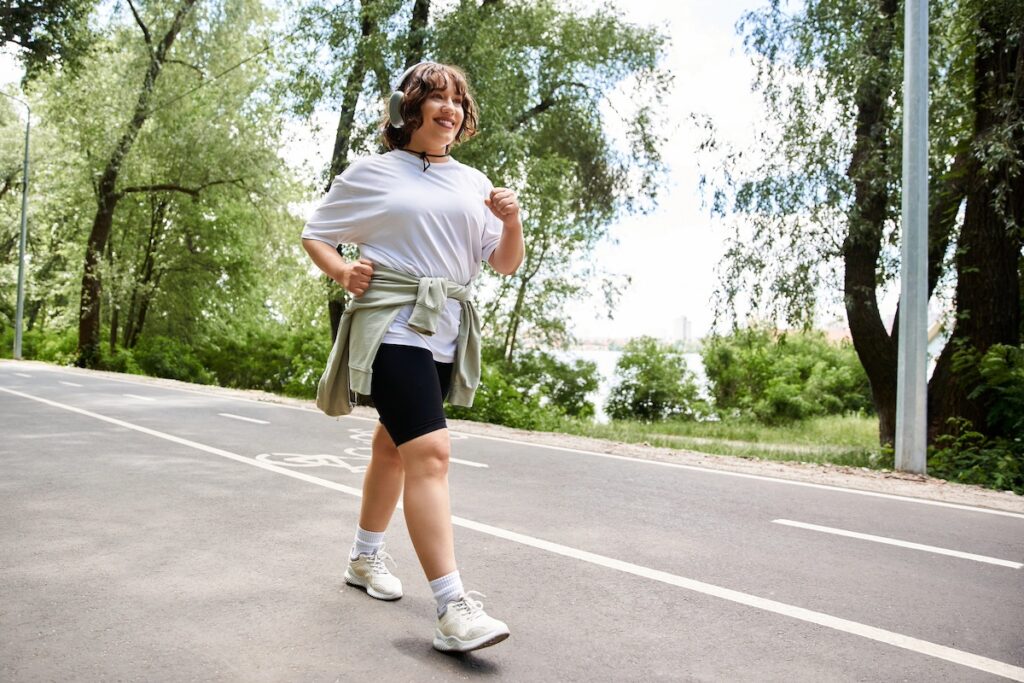 busy woman relaxed walking outdoors, using fitness tracker mindfully