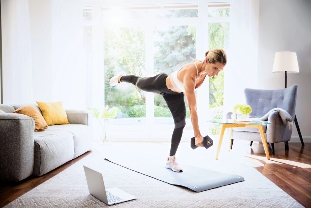 woman strength training at home as a smarter alternative to too much cardio