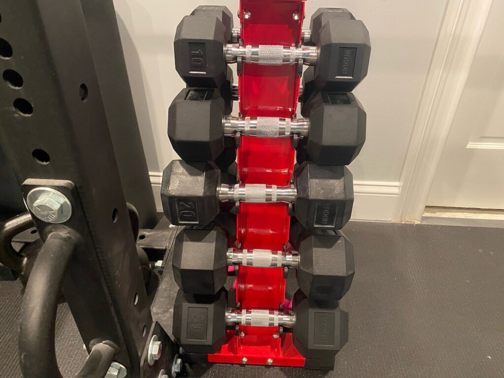 set of dumbbells used to start over with weight loss with short strength workouts instead of long cardio sessions 